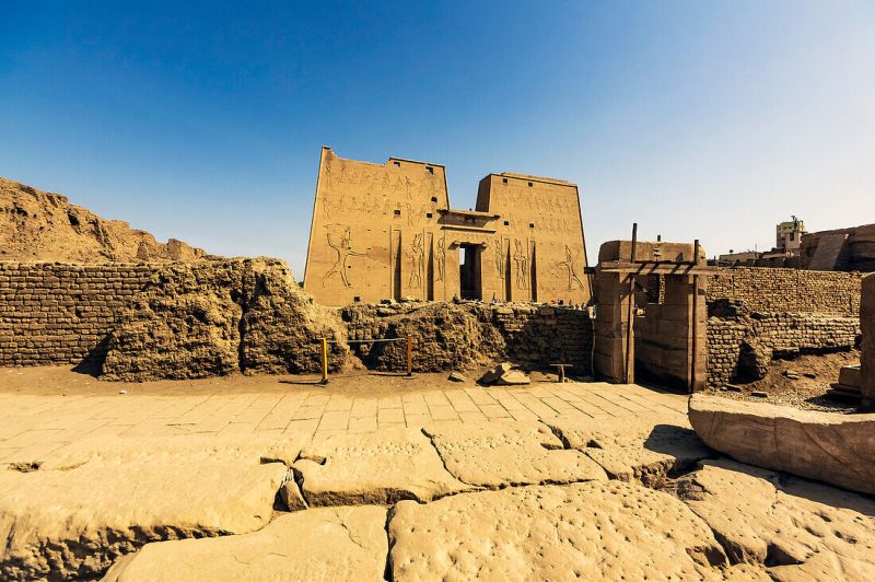 Travelers exploring the Temples of Edfu on 7-days Luxury Tours in Egypt.”